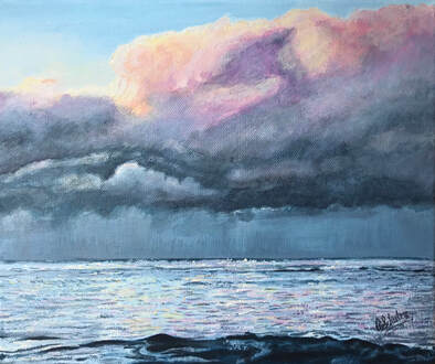Wynyard seascape with sunset clouds and rain in the distance